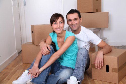 Customer handling stored items carefully in a tidy storage area